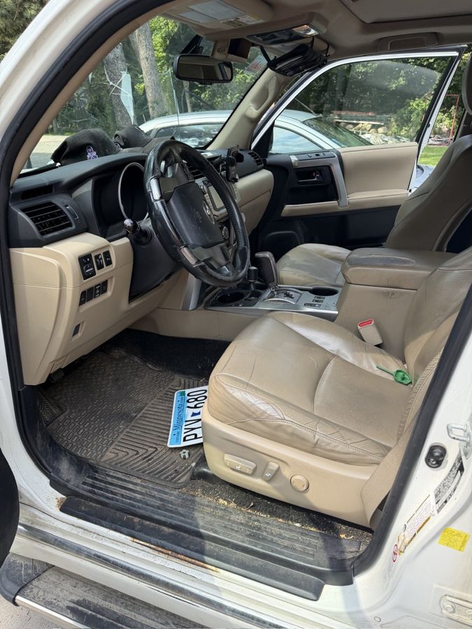 Dusty tan interior of a Toyota 4Runner before detailing