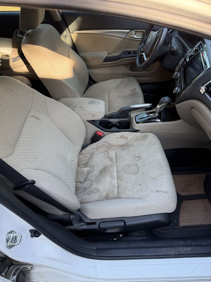 Stained cloth seat before shampooing